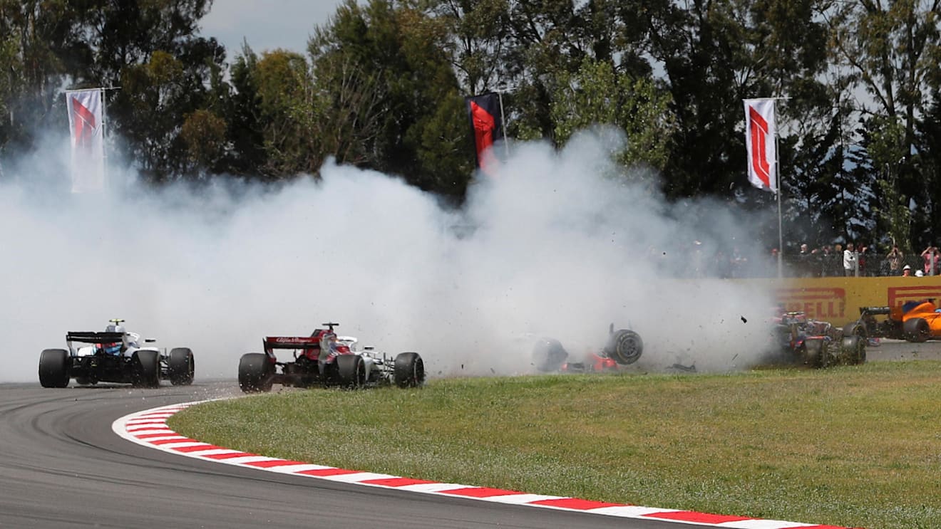 Romain Grosjean (FRA) Haas VF-18, Nico Hulkenberg (GER) Renault Sport F1 Team RS18 and Pierre Gasly (FRA) Scuderia Toro Rosso STR13 crash on lap one at Formula One World Championship, Rd5, Spanish Grand Prix, Race, Barcelona, Spain, Sunday 13 May 2018. ©