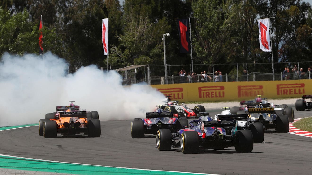 Romain Grosjean (FRA) Haas VF-18, Nico Hulkenberg (GER) Renault Sport F1 Team RS18 and Pierre Gasly (FRA) Scuderia Toro Rosso STR13 crash on lap one at Formula One World Championship, Rd5, Spanish Grand Prix, Race, Barcelona, Spain, Sunday 13 May 2018. ©