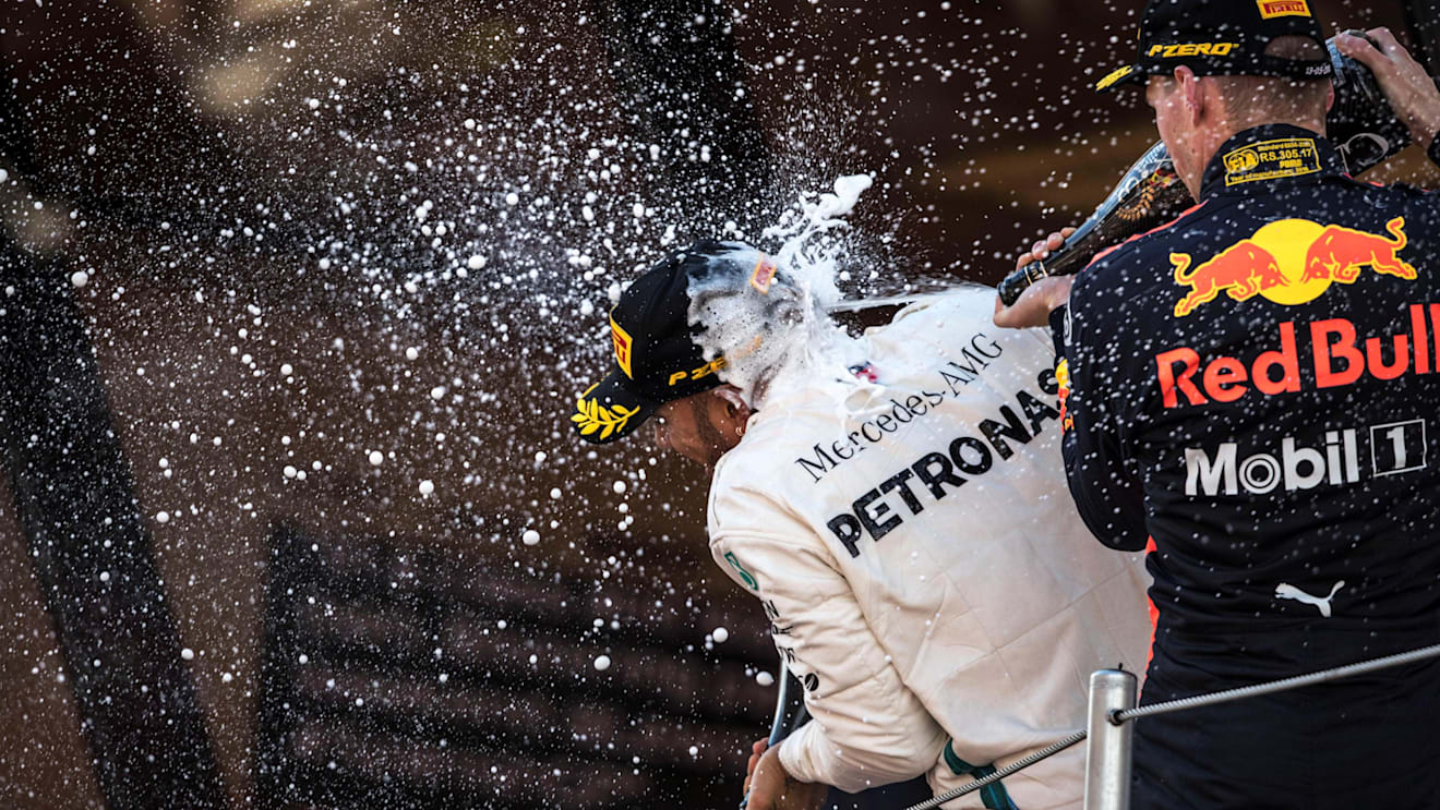Race winner Lewis Hamilton (GBR) Mercedes-AMG F1 and Max Verstappen (NED) Red Bull Racing celebrate on the podium with the champagne at Formula One World Championship, Rd5, Spanish Grand Prix, Race, Barcelona, Spain, Sunday 13 May 2018. © Manuel Goria/Sutton Images
