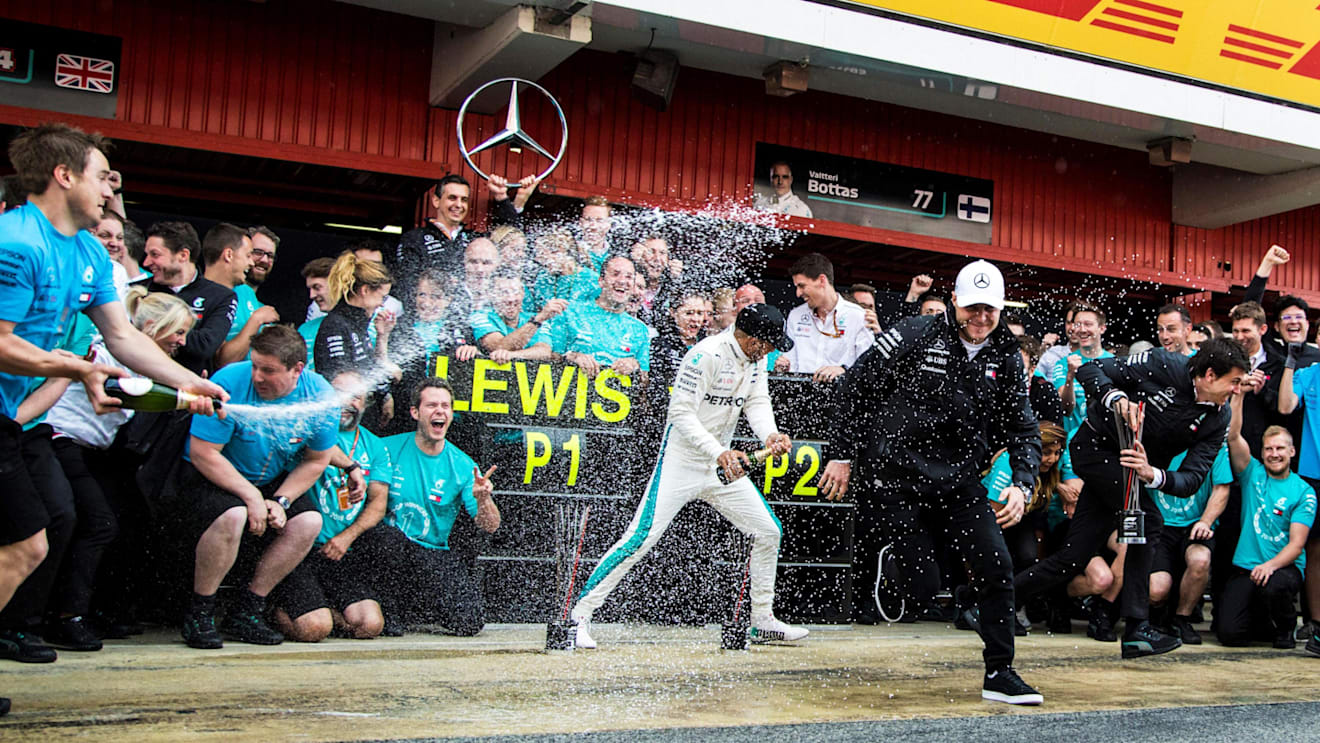 Race winner Lewis Hamilton (GBR) Mercedes-AMG F1 and Valtteri Bottas (FIN) Mercedes-AMG F1 celebrate with the team and the champagne at Formula One World Championship, Rd5, Spanish Grand Prix, Race, Barcelona, Spain, Sunday 13 May 2018. © Manuel Goria/Sut