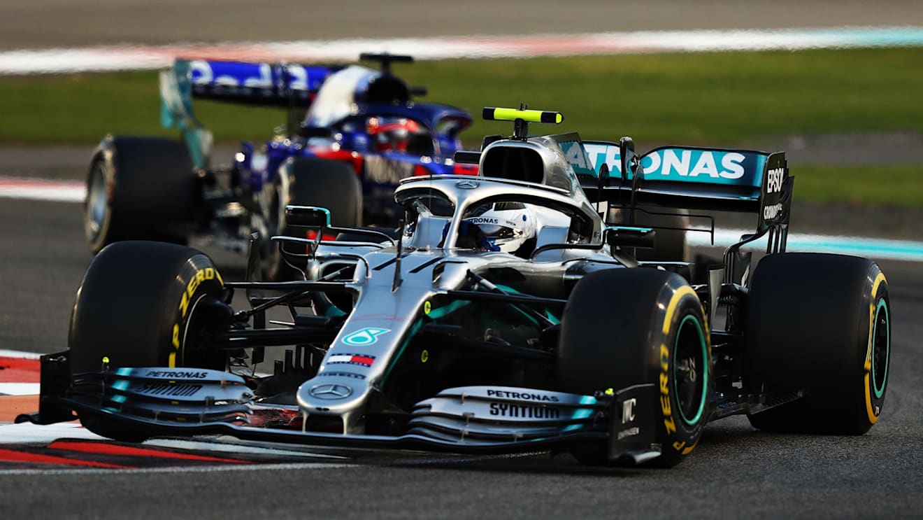 ABU DHABI, UNITED ARAB EMIRATES - DECEMBER 01: Valtteri Bottas driving the (77) Mercedes AMG Petronas F1 Team Mercedes W10 leads Daniil Kvyat driving the (26) Scuderia Toro Rosso STR14 Honda on track during the F1 Grand Prix of Abu Dhabi at Yas Marina Circuit on December 01, 2019 in Abu Dhabi, United Arab Emirates. (Photo by Francois Nel/Getty Images)