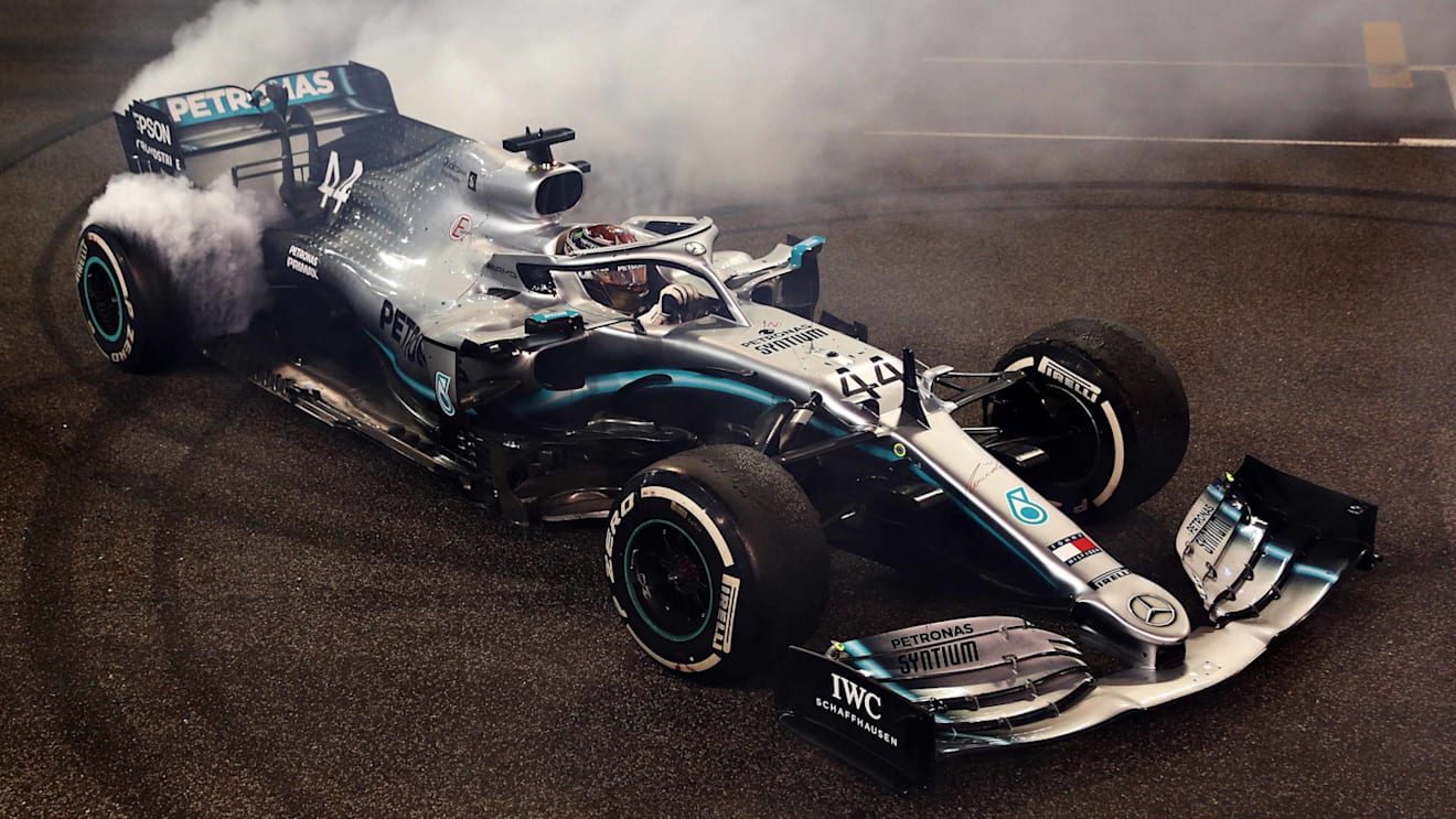 ABU DHABI, UNITED ARAB EMIRATES - DECEMBER 01: Race winner Lewis Hamilton of Great Britain and Mercedes GP celebrates with donuts on track during the F1 Grand Prix of Abu Dhabi at Yas Marina Circuit on December 01, 2019 in Abu Dhabi, United Arab Emirates. (Photo by Mark Thompson/Getty Images)