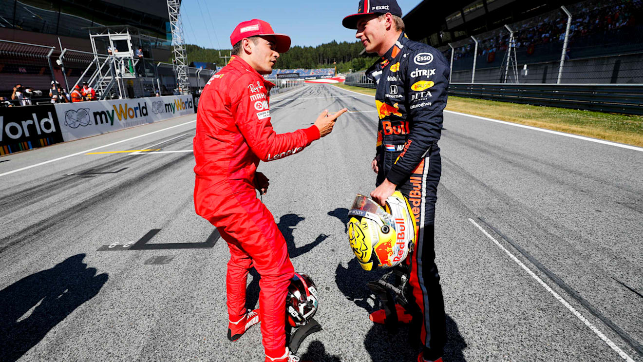 RED BULL RING, AUSTRIA - JUNE 29: Pole man Charles Leclerc, Ferrari, talks with Max Verstappen, Red Bull Racing, after Qualifying during the Austrian GP at Red Bull Ring on June 29, 2019 in Red Bull Ring, Austria. (Photo by Steven Tee / LAT Images)