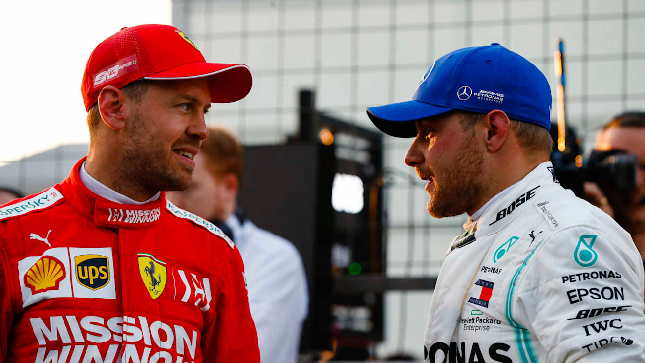 BAKU CITY CIRCUIT, AZERBAIJAN - APRIL 27: Sebastian Vettel, Ferrari, talks with pole man Valtteri Bottas, Mercedes AMG F1, after Qualifying during the Azerbaijan GP at Baku City Circuit on April 27, 2019 in Baku City Circuit, Azerbaijan. (Photo by Glenn Dunbar / LAT Images)