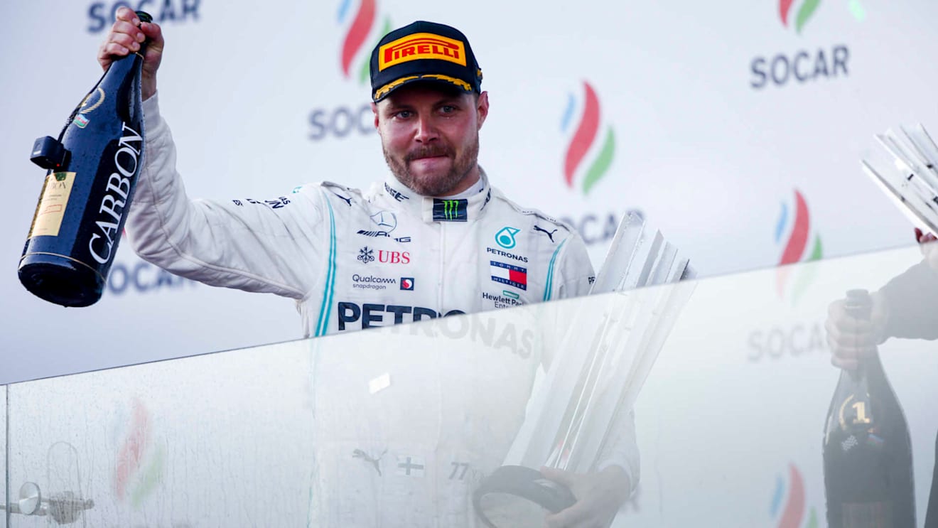 BAKU CITY CIRCUIT, AZERBAIJAN - APRIL 28: Race Winner Valtteri Bottas, Mercedes AMG F1 celebrates on the podium with the trophy and with the champagne during the Azerbaijan GP at Baku City Circuit on April 28, 2019 in Baku City Circuit, Azerbaijan. (Photo by Andy Hone / LAT Images)