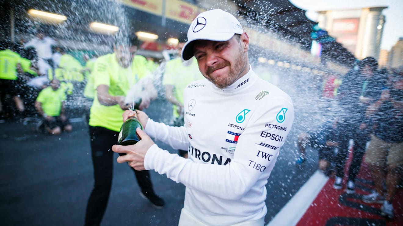 BAKU CITY CIRCUIT, AZERBAIJAN - APRIL 28: Race Winner Valtteri Bottas, Mercedes AMG F1 celebrates with the champagne and his team during the Azerbaijan GP at Baku City Circuit on April 28, 2019 in Baku City Circuit, Azerbaijan. (Photo by Joe Portlock / LAT Images)