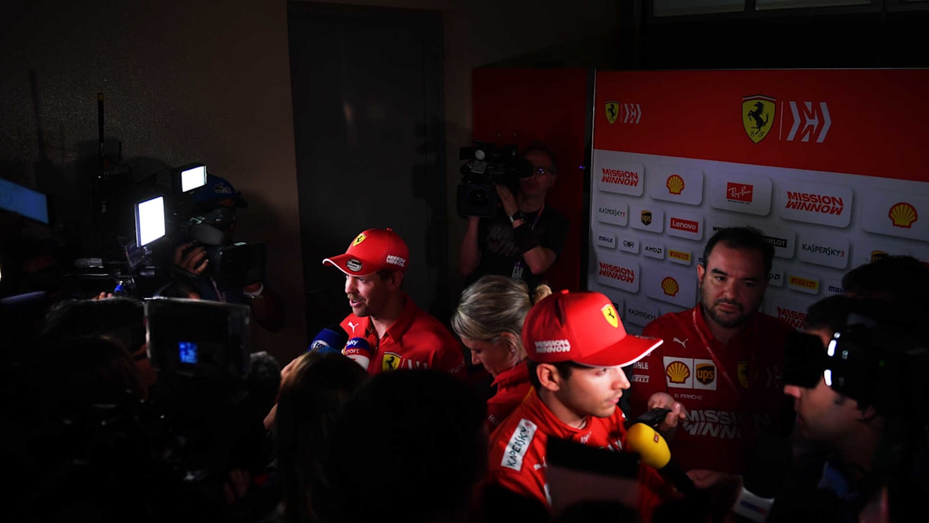 BAHRAIN INTERNATIONAL CIRCUIT, BAHRAIN - MARCH 29: Sebastian Vettel, Ferrari, and Charles Leclerc, Ferrari, talk to the media during the Bahrain GP at Bahrain International Circuit on March 29, 2019 in Bahrain International Circuit, Bahrain. (Photo by Simon Galloway / Sutton Images)