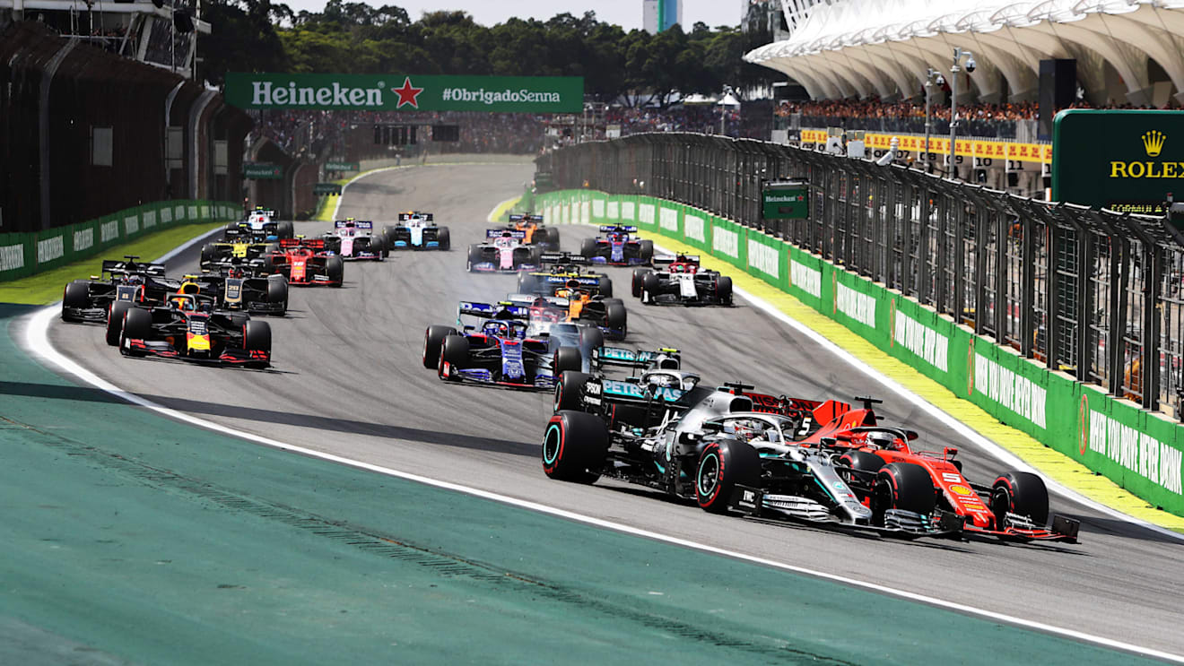 SAO PAULO, BRAZIL - NOVEMBER 17: Lewis Hamilton of Great Britain driving the (44) Mercedes AMG Petronas F1 Team Mercedes W10 and Sebastian Vettel of Germany driving the (5) Scuderia Ferrari SF90 battle for position at the start during the F1 Grand Prix of Brazil at Autodromo Jose Carlos Pace on November 17, 2019 in Sao Paulo, Brazil. (Photo by Mark Thompson/Getty Images)