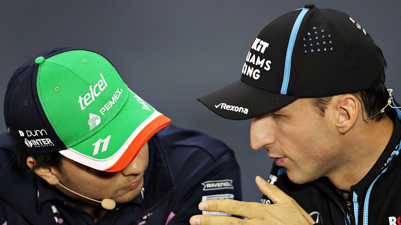 SAO PAULO, BRAZIL - NOVEMBER 14: Robert Kubica of Poland and Williams and Sergio Perez of Mexico and Racing Point talk in the Drivers Press Conference during previews ahead of the F1 Grand Prix of Brazil at Autodromo Jose Carlos Pace on November 14, 2019 in Sao Paulo, Brazil. (Photo by Robert Cianflone/Getty Images)