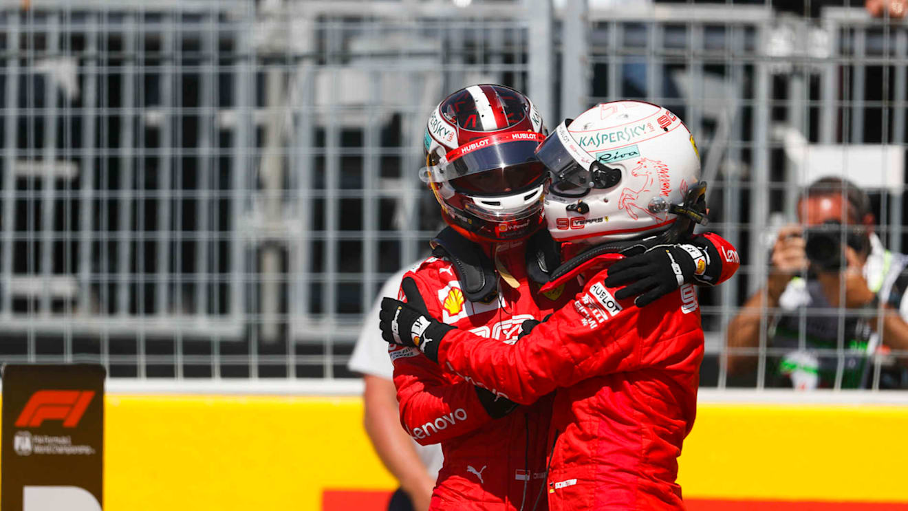 CIRCUIT GILLES-VILLENEUVE, CANADA - JUNE 08: Charles Leclerc, Ferrari, congratulates his team mate, Sebastian Vettel, Ferrari, on pole position during the Canadian GP at Circuit Gilles-Villeneuve on June 08, 2019 in Circuit Gilles-Villeneuve, Canada. (Photo by Zak Mauger / LAT Images)
