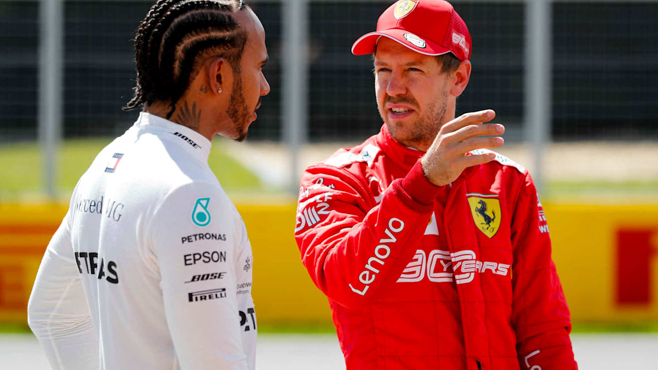 CIRCUIT GILLES-VILLENEUVE, CANADA - JUNE 08: Front row starters Lewis Hamilton, Mercedes AMG F1, and pole man Sebastian Vettel, Ferrari, talk after Qualifying during the Canadian GP at Circuit Gilles-Villeneuve on June 08, 2019 in Circuit Gilles-Villeneuve, Canada. (Photo by Steven Tee / LAT Images)