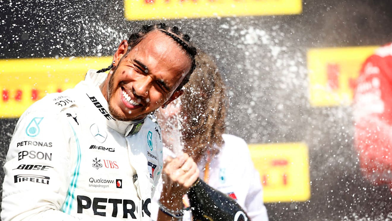 CIRCUIT GILLES-VILLENEUVE, CANADA - JUNE 09: Lewis Hamilton, Mercedes AMG F1, 1st position, sprays Champagne on the podium during the Canadian GP at Circuit Gilles-Villeneuve on June 09, 2019 in Circuit Gilles-Villeneuve, Canada. (Photo by Andy Hone / LAT Images)