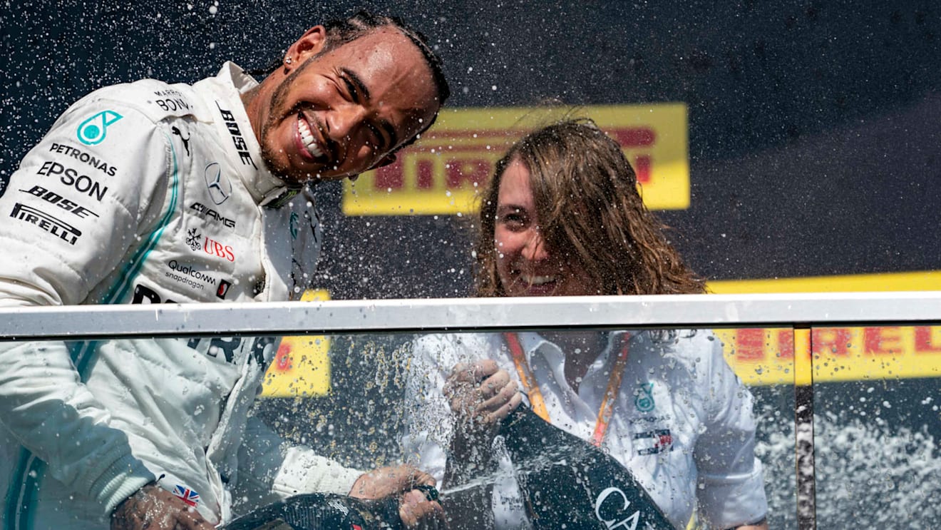CIRCUIT GILLES-VILLENEUVE, CANADA - JUNE 09: Lewis Hamilton, Mercedes AMG F1, 1st position, sprays Champagne on the podium during the Canadian GP at Circuit Gilles-Villeneuve on June 09, 2019 in Circuit Gilles-Villeneuve, Canada. (Photo by Glenn Dunbar / LAT Images)