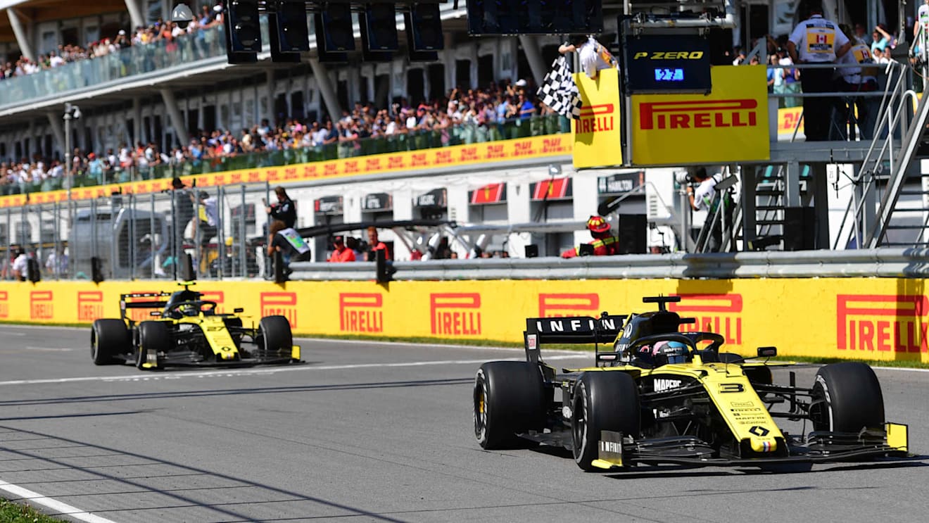CIRCUIT GILLES-VILLENEUVE, CANADA - JUNE 09: Daniel Ricciardo, Renault R.S.19, leads Nico Hulkenberg, Renault R.S. 19, past the chequered flag during the Canadian GP at Circuit Gilles-Villeneuve on June 09, 2019 in Circuit Gilles-Villeneuve, Canada. (Photo by Simon Galloway / Sutton Images)