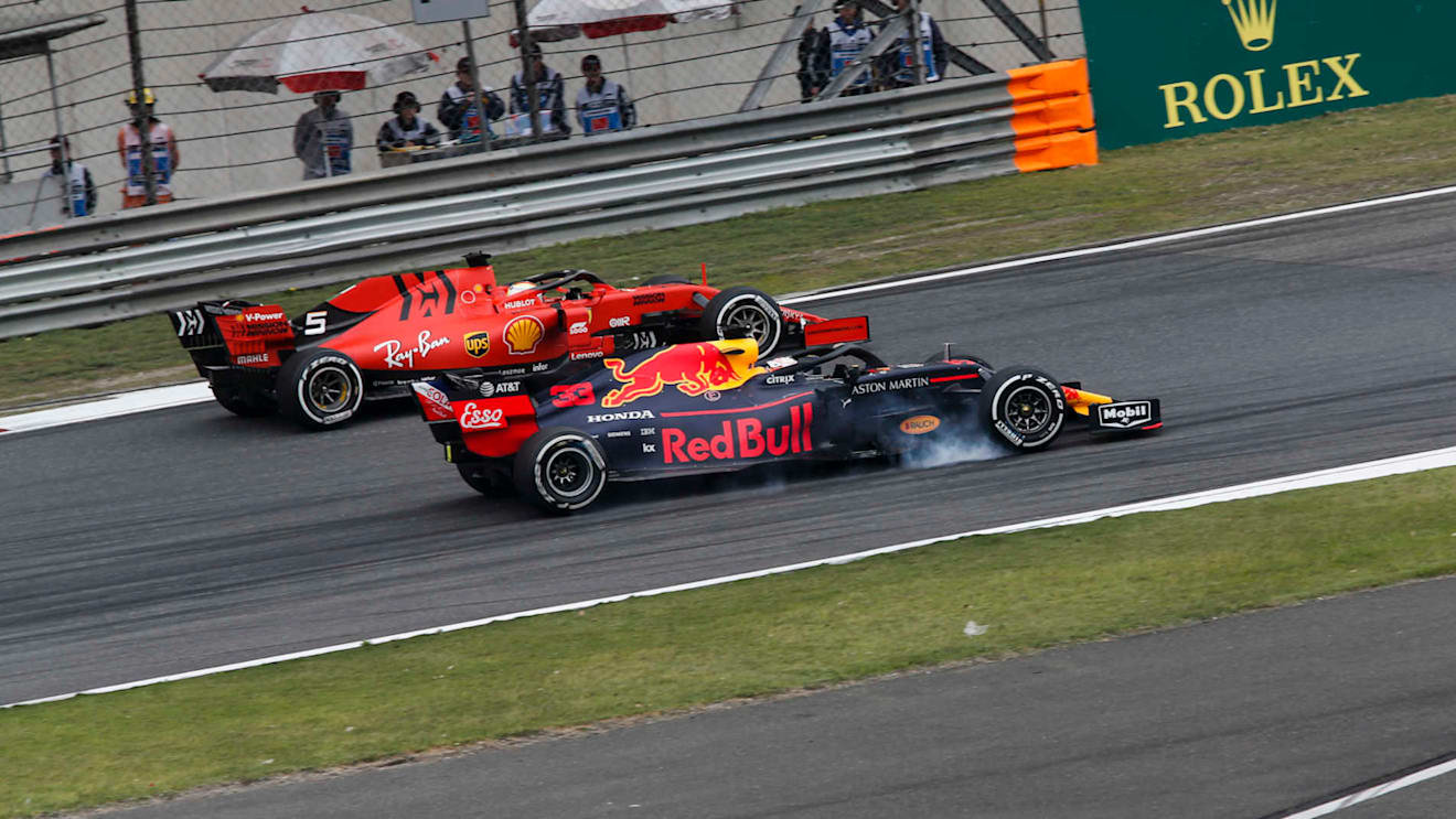 SHANGHAI INTERNATIONAL CIRCUIT, CHINA - APRIL 14: Sebastian Vettel, Ferrari SF90 and Max Verstappen, Red Bull Racing RB15 battle during the Chinese GP at Shanghai International Circuit on April 14, 2019 in Shanghai International Circuit, China. (Photo by Joe Portlock / LAT Images)