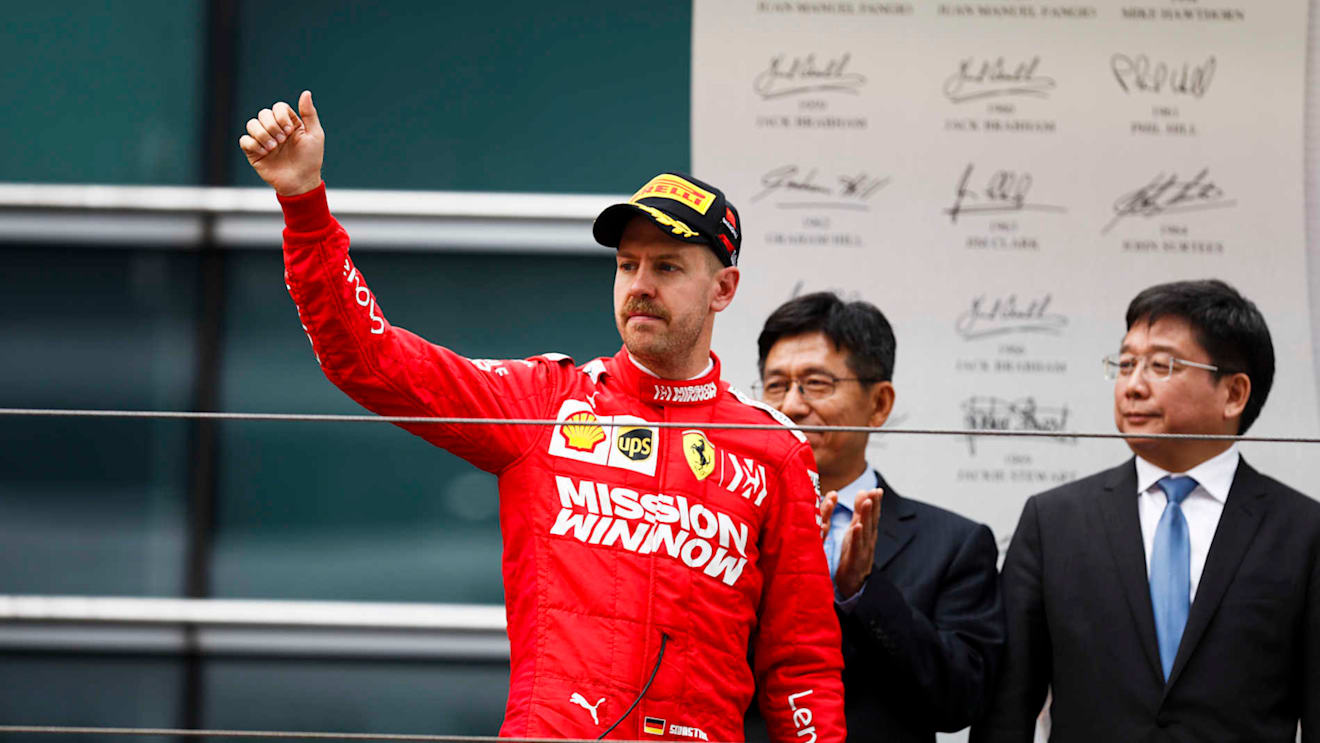 SHANGHAI INTERNATIONAL CIRCUIT, CHINA - APRIL 14: Sebastian Vettel, Ferrari celebrates on the podium during the Chinese GP at Shanghai International Circuit on April 14, 2019 in Shanghai International Circuit, China. (Photo by Glenn Dunbar / LAT Images)