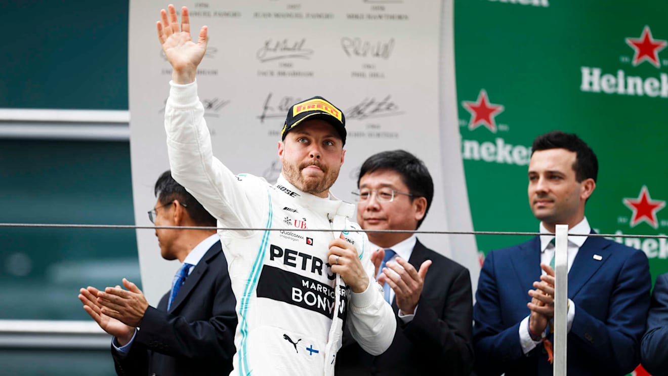 SHANGHAI INTERNATIONAL CIRCUIT, CHINA - APRIL 14: Valtteri Bottas, Mercedes AMG F1 celebrates on the podium during the Chinese GP at Shanghai International Circuit on April 14, 2019 in Shanghai International Circuit, China. (Photo by Glenn Dunbar / LAT Images)
