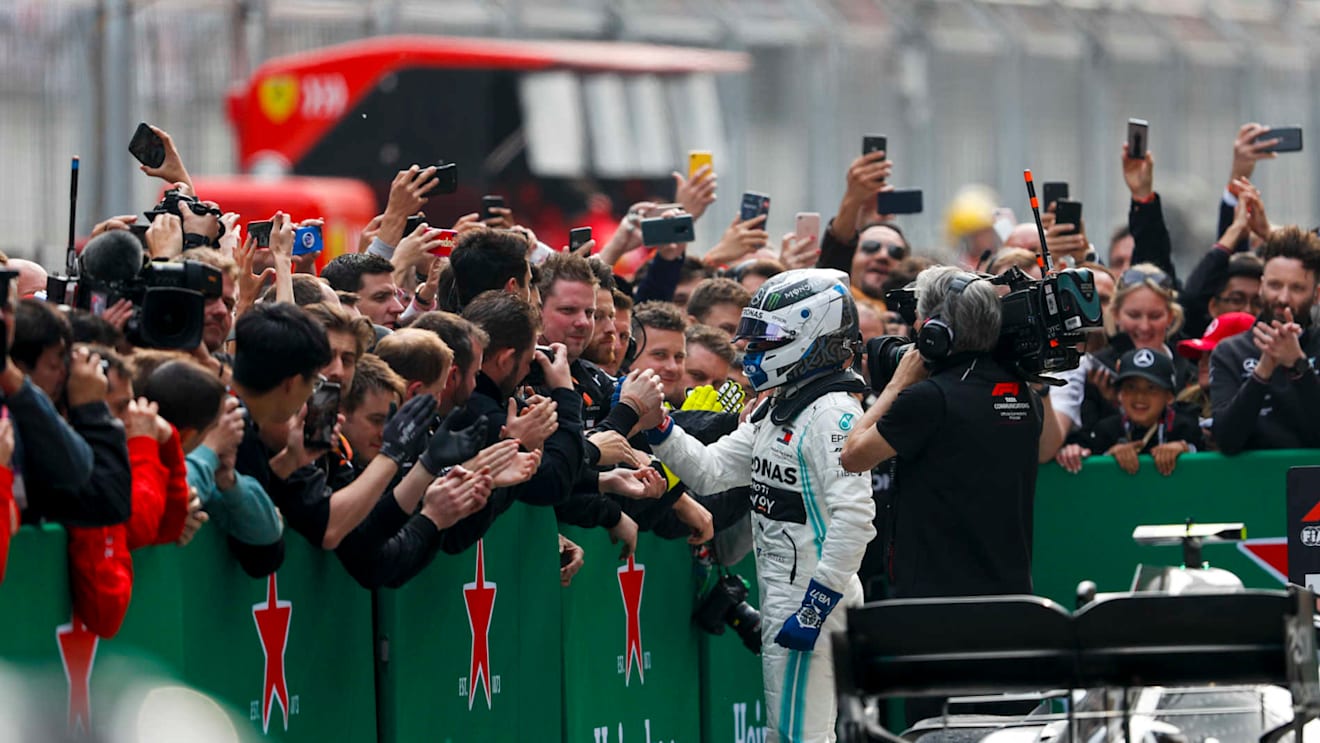 SHANGHAI INTERNATIONAL CIRCUIT, CHINA - APRIL 14: Valtteri Bottas, Mercedes AMG F1, 2nd position, celebrates with his team in Parc Ferme during the Chinese GP at Shanghai International Circuit on April 14, 2019 in Shanghai International Circuit, China. (Photo by Zak Mauger / LAT Images)