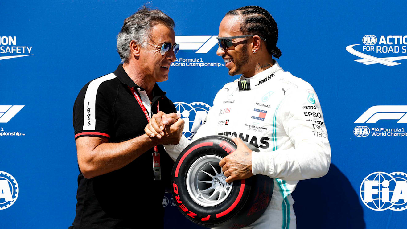 CIRCUIT PAUL RICARD, FRANCE - JUNE 22: Jean Alesi presents Lewis Hamilton, Mercedes AMG F1, with his Pirelli Pole Position award during the French GP at Circuit Paul Ricard on June 22, 2019 in Circuit Paul Ricard, France. (Photo by Glenn Dunbar / LAT Images)