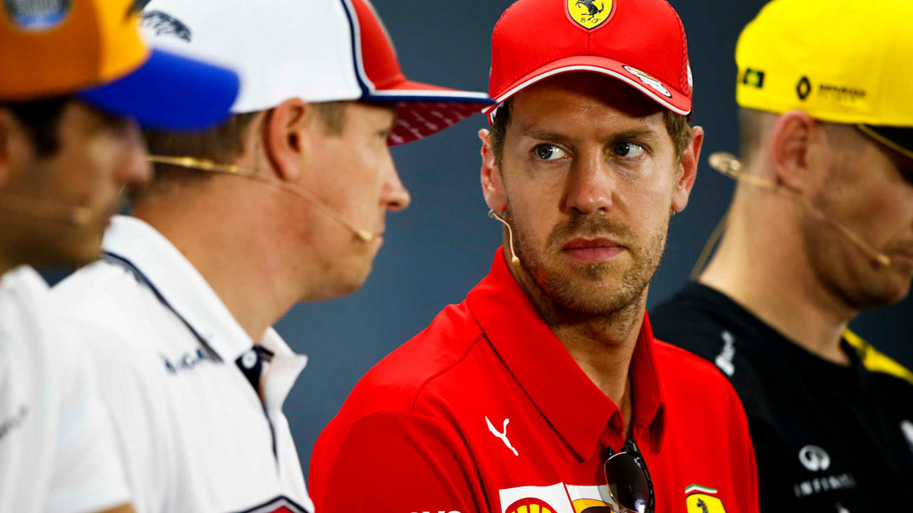 HOCKENHEIMRING, GERMANY - JULY 25: Sebastian Vettel, Ferrari and Kimi Raikkonen, Alfa Romeo Racing talk in the Press Conference during the German GP at Hockenheimring on July 25, 2019 in Hockenheimring, Germany. (Photo by Andy Hone / LAT Images)