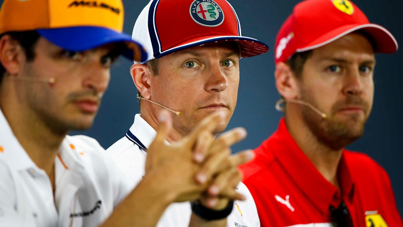 HOCKENHEIMRING, GERMANY - JULY 25: Carlos Sainz Jr, McLaren, Kimi Raikkonen, Alfa Romeo Racing and Sebastian Vettel, Ferrari in the Press Conference during the German GP at Hockenheimring on July 25, 2019 in Hockenheimring, Germany. (Photo by Andy Hone / LAT Images)