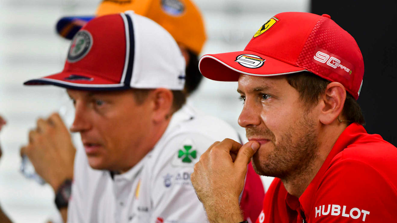 HOCKENHEIMRING, GERMANY - JULY 25: Sebastian Vettel, Ferrari and Kimi Raikkonen, Alfa Romeo Racing In the Press Conference during the German GP at Hockenheimring on July 25, 2019 in Hockenheimring, Germany. (Photo by Mark Sutton / Sutton Images)