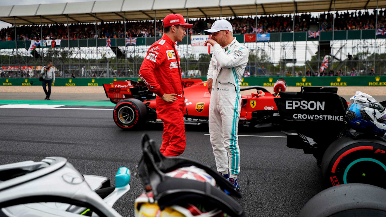SILVERSTONE, UNITED KINGDOM - JULY 13: Charles Leclerc, Ferrari, talks with pole man Valtteri Bottas, Mercedes AMG F1, after Qualifying during the British GP at Silverstone on July 13, 2019 in Silverstone, United Kingdom. (Photo by Glenn Dunbar / LAT Images)