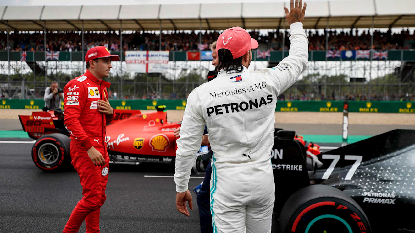 SILVERSTONE, UNITED KINGDOM - JULY 13: Charles Leclerc, Ferrari, and Lewis Hamilton, Mercedes AMG F1, on the grid after Qualifying during the British GP at Silverstone on July 13, 2019 in Silverstone, United Kingdom. (Photo by Glenn Dunbar / LAT Images)