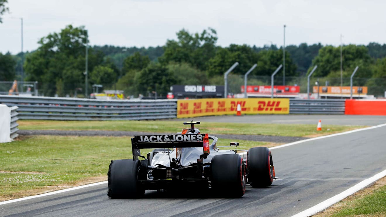 SILVERSTONE, UNITED KINGDOM - JULY 14: Kevin Magnussen, Haas VF-19, heads int the pits with a rear puncture during the British GP at Silverstone on July 14, 2019 in Silverstone, United Kingdom. (Photo by Zak Mauger / LAT Images)