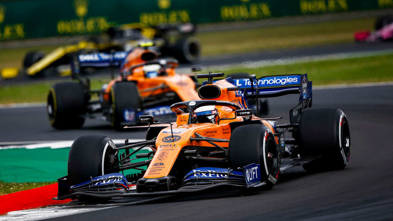 SILVERSTONE, UNITED KINGDOM - JULY 14: Carlos Sainz, McLaren MCL34, leads Lando Norris, McLaren MCL34 during the British GP at Silverstone on July 14, 2019 in Silverstone, United Kingdom. (Photo by Andy Hone / LAT Images)