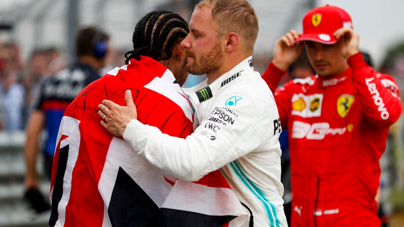 SILVERSTONE, UNITED KINGDOM - JULY 14: Race winner Lewis Hamilton, Mercedes AMG F1 and Valtteri Bottas, Mercedes AMG F1 celebrate in Parc Ferme during the British GP at Silverstone on July 14, 2019 in Silverstone, United Kingdom. (Photo by Zak Mauger / LAT Images)