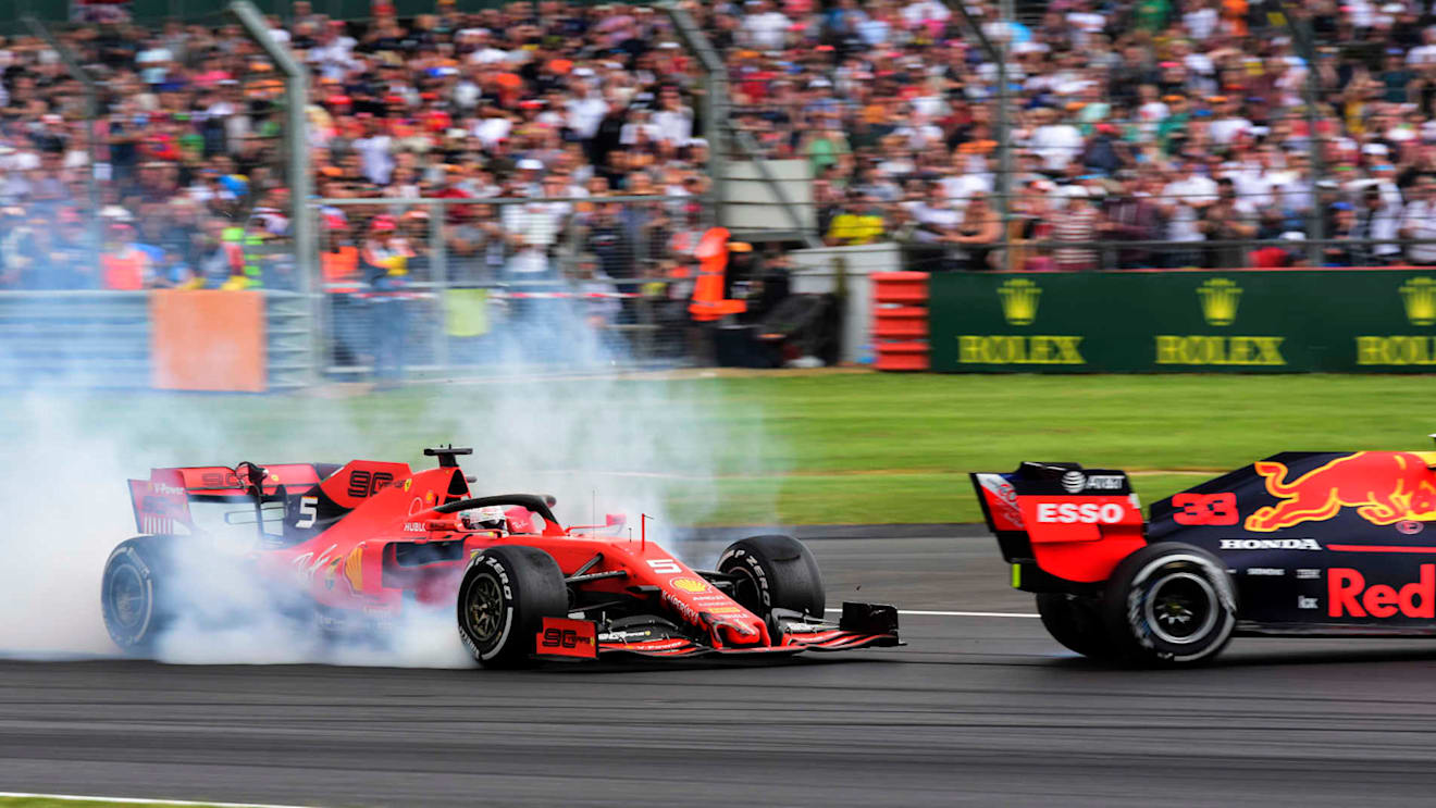 SILVERSTONE, UNITED KINGDOM - JULY 14: Sebastian Vettel, Ferrari SF90 running into the back of Max Verstappen, Red Bull Racing RB15 during the British GP at Silverstone on July 14, 2019 in Silverstone, United Kingdom. (Photo by Hasan Bratic / LAT Images)