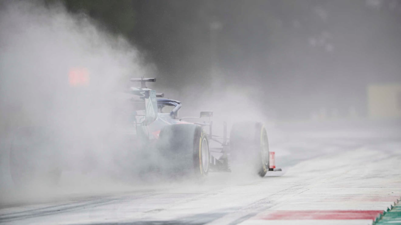 HUNGARORING, HUNGARY - AUGUST 03: Daniil Kvyat, Toro Rosso STR14, kicks up cement dust which was laid down to cover a heavy oil spill in the F2 race prior to the session during the Hungarian GP at Hungaroring on August 03, 2019 in Hungaroring, Hungary. (Photo by Sam Bloxham / LAT Images)