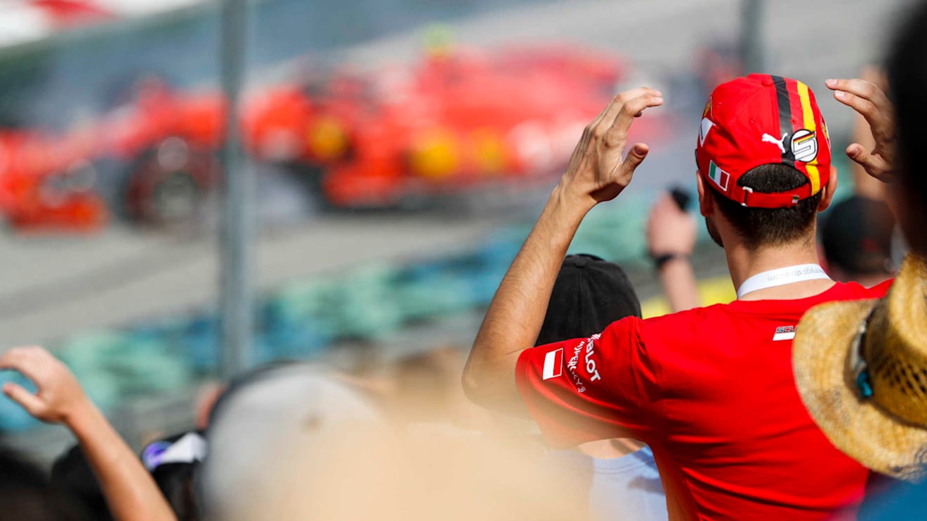 HUNGARORING, HUNGARY - AUGUST 03: Ferrari fan watching the crash of Charles Leclerc, Ferrari SF90 during the Hungarian GP at Hungaroring on August 03, 2019 in Hungaroring, Hungary. (Photo by Zak Mauger / LAT Images)