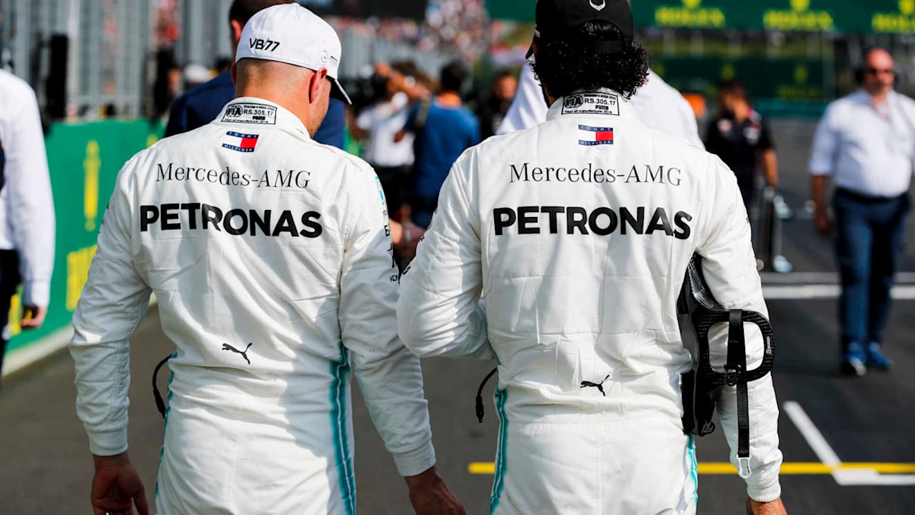 HUNGARORING, HUNGARY - AUGUST 03: Valtteri Bottas, Mercedes AMG F1, and Lewis Hamilton, Mercedes AMG F1, on the grid after Qualifying during the Hungarian GP at Hungaroring on August 03, 2019 in Hungaroring, Hungary. (Photo by Steven Tee / LAT Images)