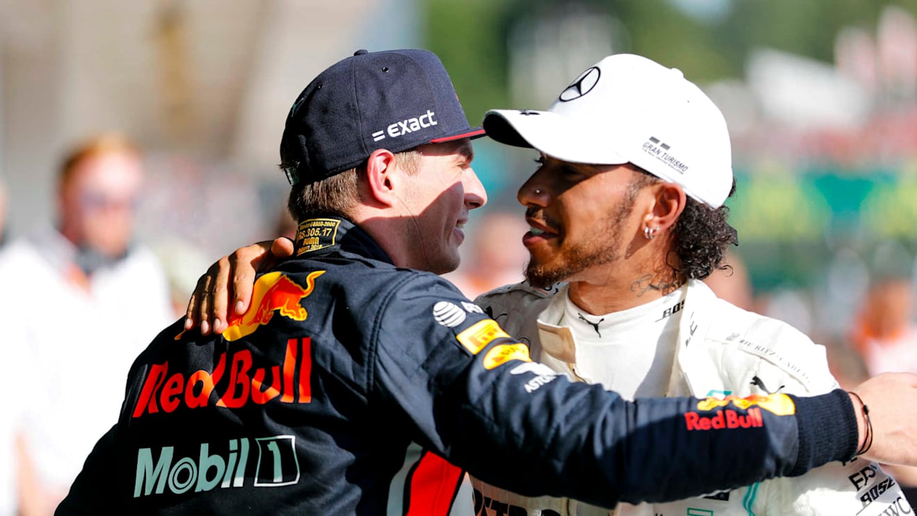 HUNGARORING, HUNGARY - AUGUST 04: Max Verstappen, Red Bull Racing and Race winner Lewis Hamilton, Mercedes AMG F1 celebrate in Parc Ferme during the Hungarian GP at Hungaroring on August 04, 2019 in Hungaroring, Hungary. (Photo by Steven Tee / LAT Images)