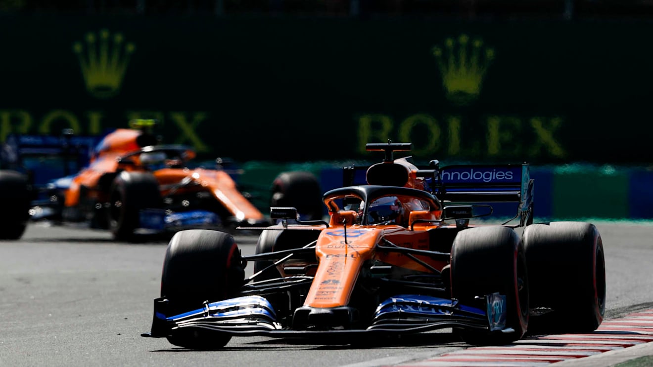 HUNGARORING, HUNGARY - AUGUST 04: Carlos Sainz, McLaren MCL34, leads Lando Norris, McLaren MCL34 during the Hungarian GP at Hungaroring on August 04, 2019 in Hungaroring, Hungary. (Photo by Zak Mauger / LAT Images)