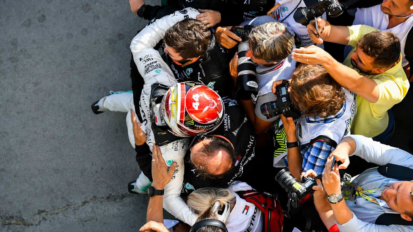 HUNGARORING, HUNGARY - AUGUST 04: Lewis Hamilton, Mercedes AMG F1, 1st position, celebrates with his team in Parc Ferme during the Hungarian GP at Hungaroring on August 04, 2019 in Hungaroring, Hungary. (Photo by Mark Sutton / Sutton Images)