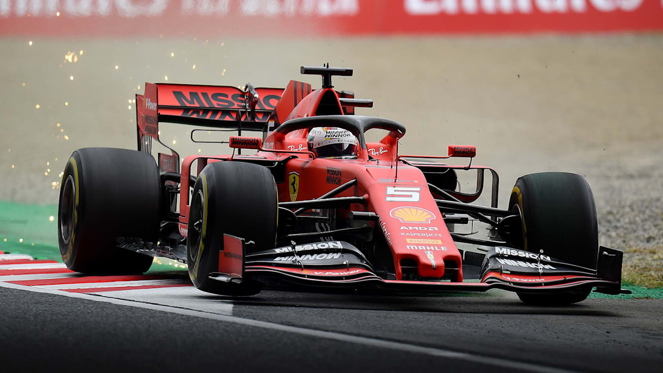 SUZUKA, JAPAN - OCTOBER 11: Sparks fly behind Sebastian Vettel of Germany driving the (5) Scuderia Ferrari SF90 on track during practice for the F1 Grand Prix of Japan at Suzuka Circuit on October 11, 2019 in Suzuka, Japan. (Photo by Clive Mason/Getty Images)