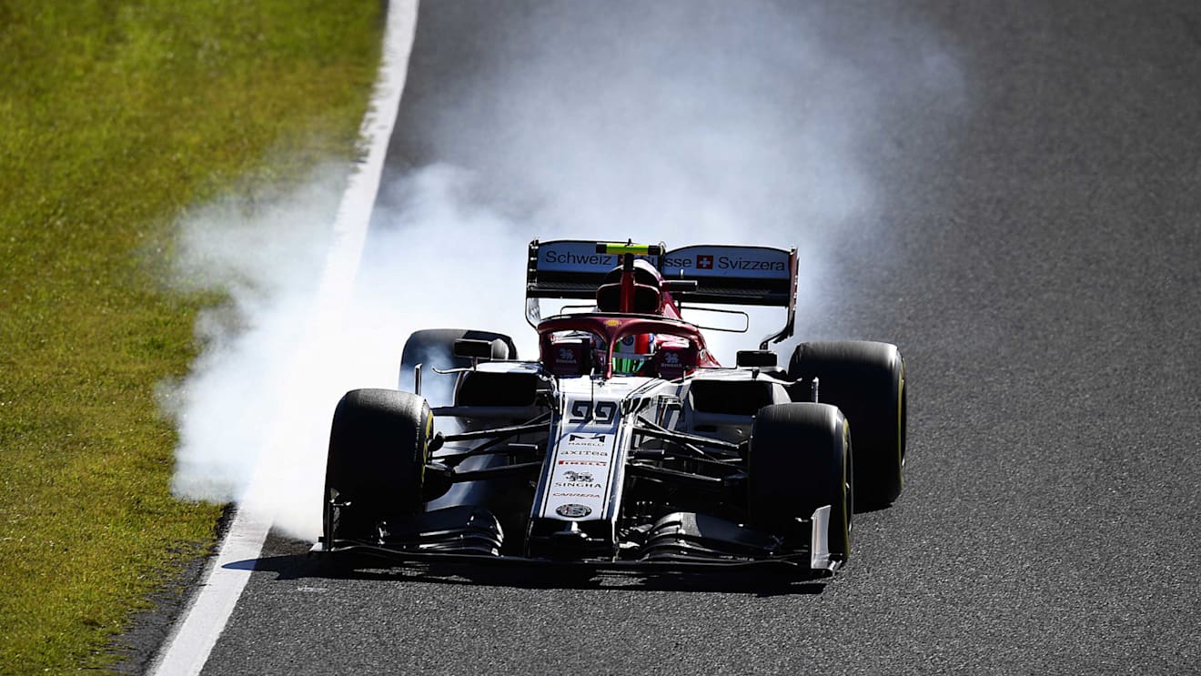 SUZUKA, JAPAN - OCTOBER 13: Antonio Giovinazzi of Italy driving the (99) Alfa Romeo Racing C38 Ferrari locks a wheel under braking during the F1 Grand Prix of Japan at Suzuka Circuit on October 13, 2019 in Suzuka, Japan. (Photo by Clive Mason/Getty Images)