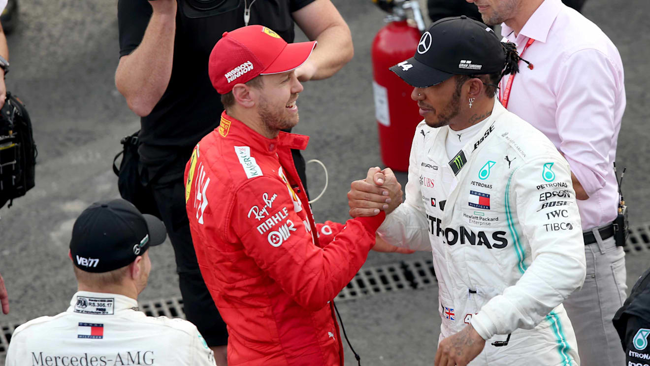 MEXICO CITY, MEXICO - OCTOBER 27: Race winner Lewis Hamilton of Great Britain and Mercedes GP and second placed Sebastian Vettel of Germany and Ferrari celebrate in parc ferme during the F1 Grand Prix of Mexico at Autodromo Hermanos Rodriguez on October 27, 2019 in Mexico City, Mexico. (Photo by Charles Coates/Getty Images)