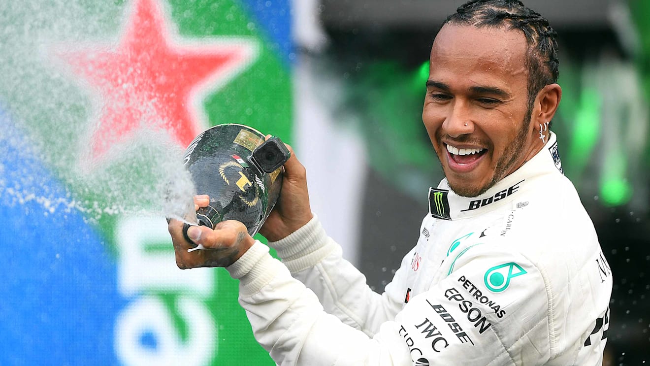 MEXICO CITY, MEXICO - OCTOBER 27: Race winner Lewis Hamilton of Great Britain and Mercedes GP celebrates on the podium during the F1 Grand Prix of Mexico at Autodromo Hermanos Rodriguez on October 27, 2019 in Mexico City, Mexico. (Photo by Clive Mason/Getty Images)