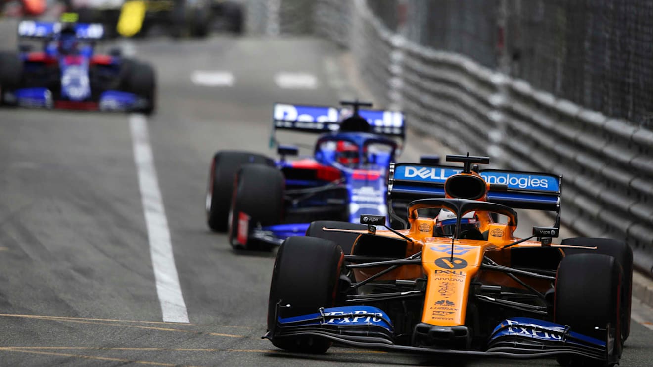 MONTE CARLO, MONACO - MAY 26: Carlos Sainz, McLaren MCL34, leads Daniil Kvyat, Toro Rosso STR14 during the Monaco GP at Monte Carlo on May 26, 2019 in Monte Carlo, Monaco. (Photo by Dom Romney / LAT Images)