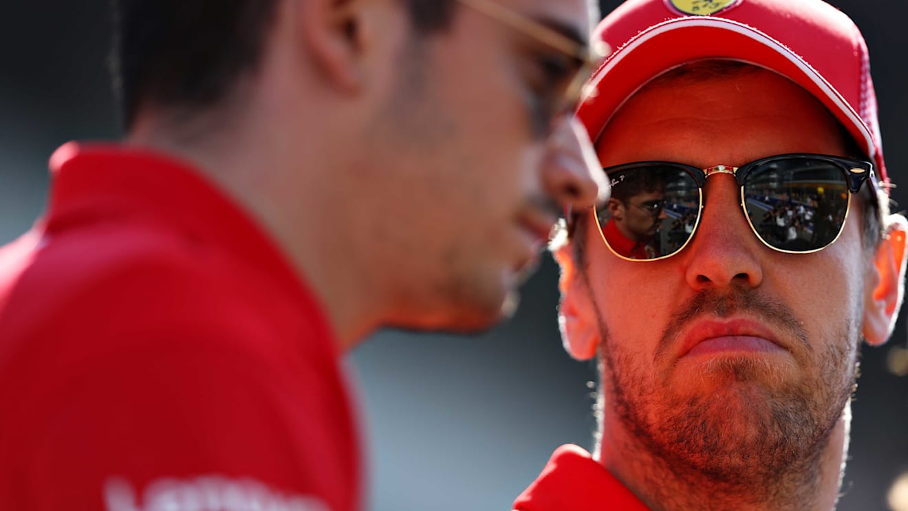 SOCHI, RUSSIA - SEPTEMBER 29: Charles Leclerc of Monaco and Ferrari and Sebastian Vettel of Germany and Ferrari look on, on the drivers parade before the F1 Grand Prix of Russia at Sochi Autodrom on September 29, 2019 in Sochi, Russia. (Photo by Mark Thompson/Getty Images)