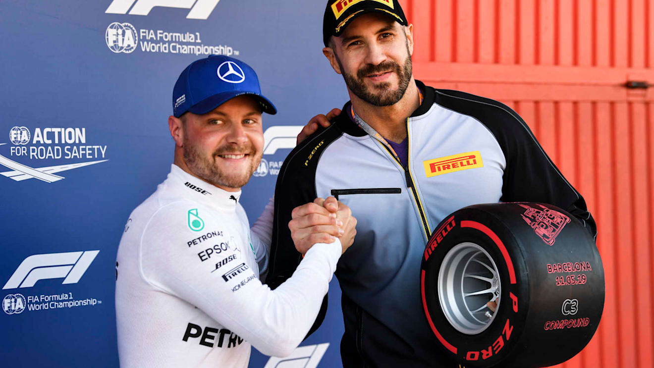 CIRCUIT DE BARCELONA-CATALUNYA, SPAIN - MAY 11: WWE wrestler Cesaro presents Valtteri Bottas, Mercedes AMG F1, with his Pirelli Pole Position award during the Spanish GP at Circuit de Barcelona-Catalunya on May 11, 2019 in Circuit de Barcelona-Catalunya, Spain. (Photo by Mark Sutton / Sutton Images)