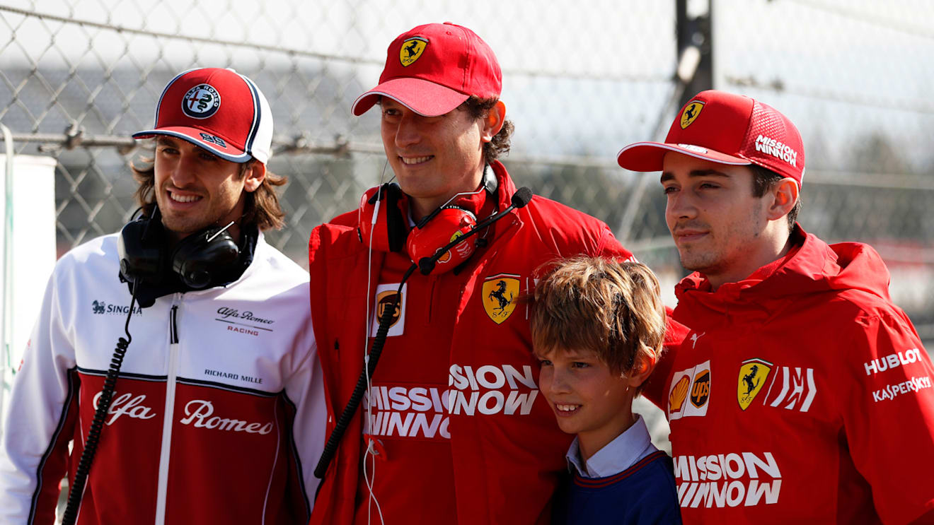 CIRCUIT DE BARCELONA-CATALUNYA, SPAIN - MARCH 01: (L to R): Antonio Giovinazzi, Alfa Romeo Racing, John Elkann, FIAT Chairman with his son and Charles Leclerc, Ferrari during the Barcelona February testing II at Circuit de Barcelona-Catalunya on March 01, 2019 in Circuit de Barcelona-Catalunya, Spain. (Photo by Zak Mauger / LAT Images)