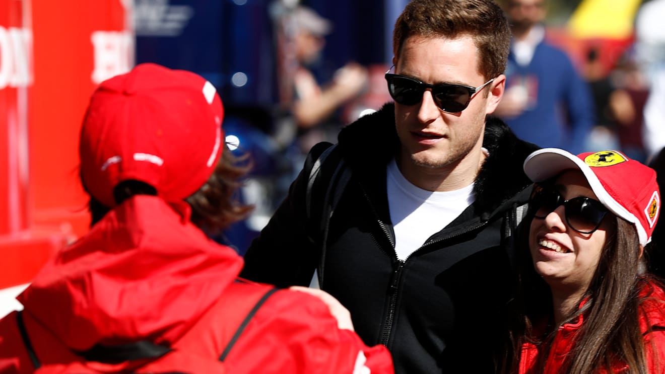 CIRCUIT DE BARCELONA-CATALUNYA, SPAIN - FEBRUARY 26: Stoffel Vandoorne poses for a photo with a fan during the Barcelona February testing II at Circuit de Barcelona-Catalunya on February 26, 2019 in Circuit de Barcelona-Catalunya, Spain. (Photo by Glenn Dunbar / LAT Images)