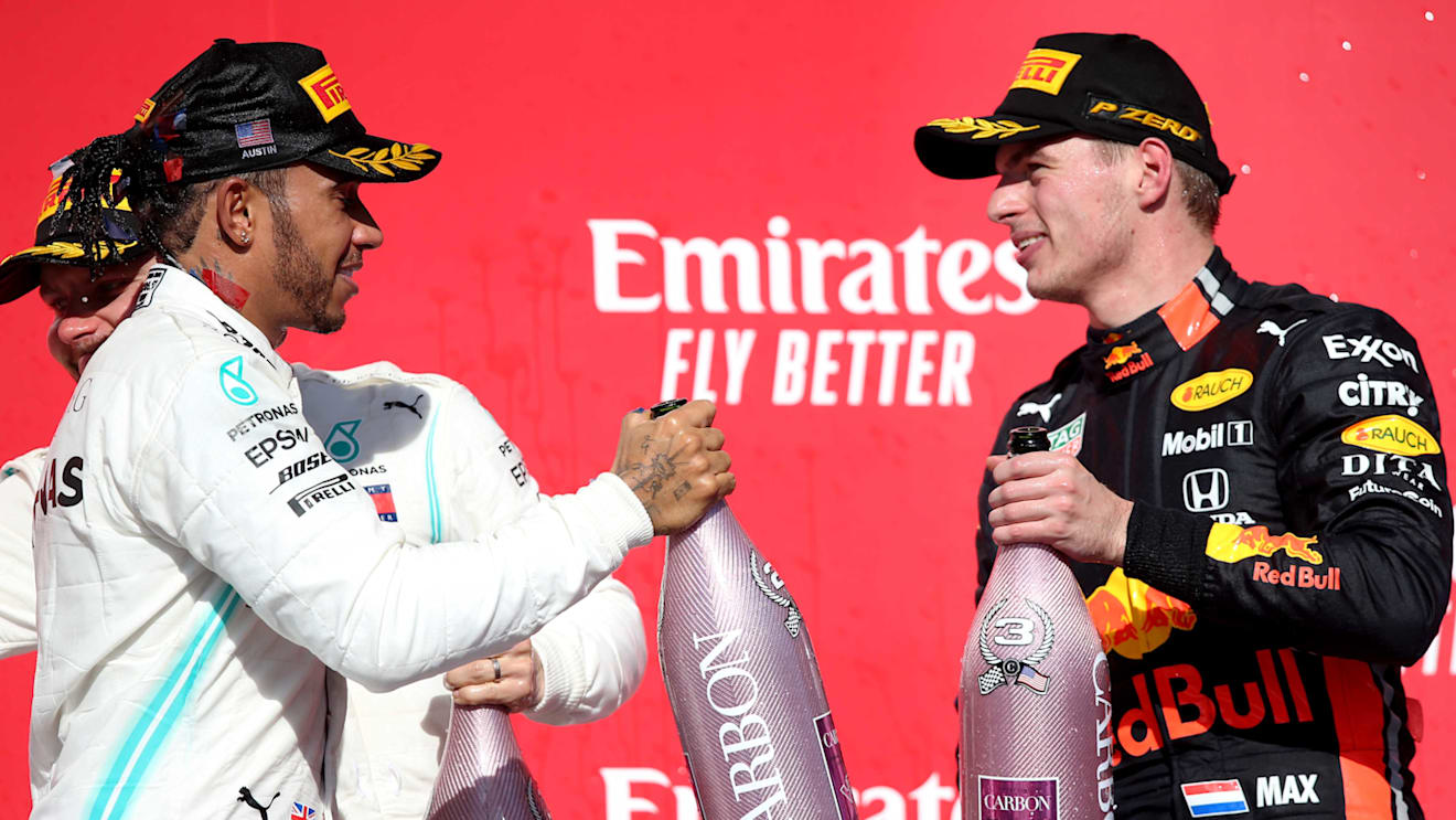 AUSTIN, TEXAS - NOVEMBER 03: 2019 Formula One World Drivers Champion Lewis Hamilton of Great Britain and Mercedes GP is congratulated by third placed Max Verstappen of Netherlands and Red Bull Racing on the podium during the F1 Grand Prix of USA at Circuit of The Americas on November 03, 2019 in Austin, Texas. (Photo by Charles Coates/Getty Images)