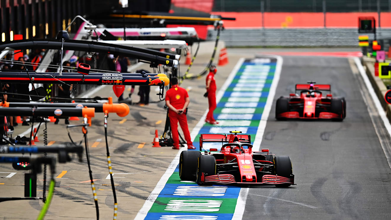 NORTHAMPTON, ENGLAND - AUGUST 07: Charles Leclerc of Monaco driving the (16) Scuderia Ferrari SF1000 and Sebastian Vettel of Germany driving the (5) Scuderia Ferrari SF1000 in the Pitlane  during practice for the F1 70th Anniversary Grand Prix at Silverstone on August 07, 2020 in Northampton, England. (Photo by Clive Mason - Formula 1/Formula 1 via Getty Images)