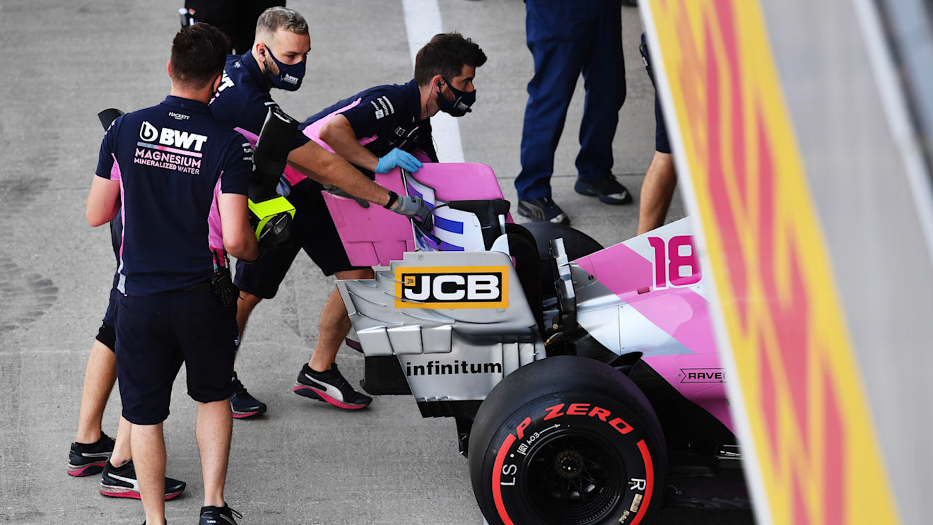 NORTHAMPTON, ENGLAND - AUGUST 08: Racing Point team members push the car of Lance Stroll of Canada driving the (18) Racing Point RP20 Mercedes in the Pitlane during final practice for the F1 70th Anniversary Grand Prix at Silverstone on August 08, 2020 in Northampton, England. (Photo by Ben Stansall/Pool via Getty Images)